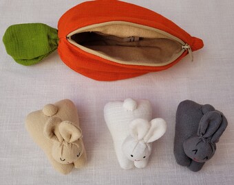 A Carrot Purse Bursting With Three Bunnies 1 White 1 Beige 1 