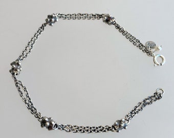 Sterling silver chain bracelet adorned with small bearings/spikes, ending with a small pearl; handmade bracelet; oxidized bracelet; jewelry.