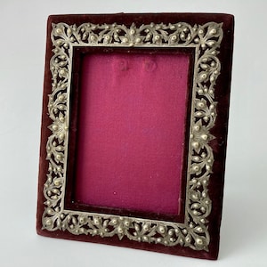 VICTORIAN PICTURE FRAME - 19th century French rectangular easel frame with garnet velvet and silver repousse decor