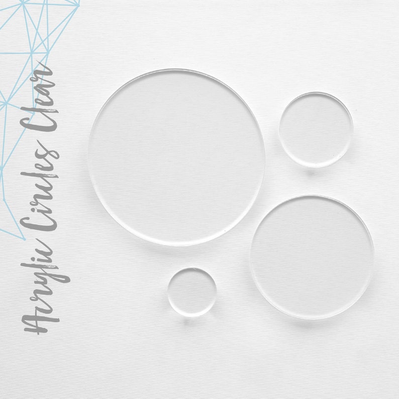 May include: Four clear acrylic circles of varying sizes. The circles are arranged in a staggered pattern on a white background.