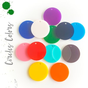 May include: Assortment of 12 colorful circles with a hole in the center. The circles are made of acrylic and are available in a variety of colors, including red, blue, green, yellow, orange, purple, pink, white, and black.