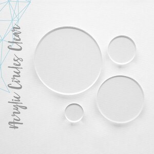 May include: Four clear acrylic circles of varying sizes. The circles are arranged in a staggered pattern on a white background.