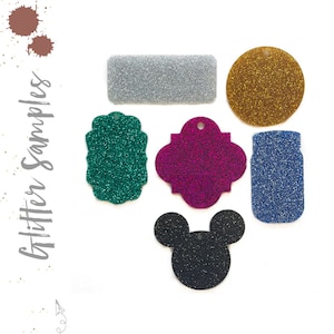 May include: Assortment of glitter craft supplies in various shapes and colors, including a silver rectangle, gold circle, teal rectangle, pink quatrefoil, blue jar, and black Mickey Mouse head.