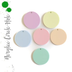 May include: Six pastel colored acrylic circles with a hole in the center. The colors are light blue, light pink, light green, light yellow, light purple, and peach.