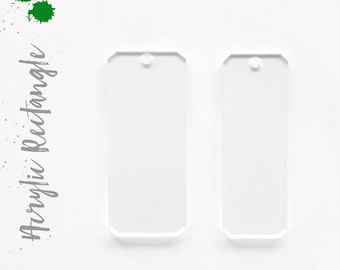 May include: Two clear acrylic rectangle shapes with rounded corners and a hole at the top. The shapes are on a white background.