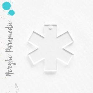 May include: A clear acrylic keychain shaped like a Star of Life, a symbol used by emergency medical services.