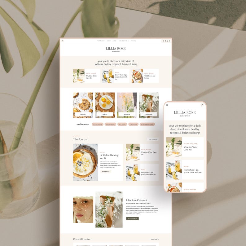 May include: A website design mockup featuring the "LILLIA ROSE" brand, displayed on a laptop and a smartphone. The design showcases a clean, minimalist aesthetic with soft beige and white tones, and includes the text "your go-to place for a daily dose of wellness, healthy recipes & balanced living."