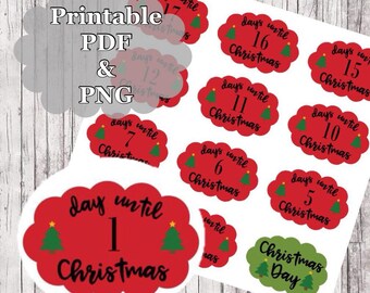 May include: Printable Christmas countdown stickers with red and green colors. The stickers feature a cloud shape with the text "days until Christmas" and a number from 1 to 17. There is also a sticker that says "Christmas Day".