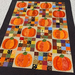 Pumpkin Quilt, fall, autumn, throw size, pumpkins, orange, dots, fray edges, handmade, scrappy squares, quilted, raw edges, green, purple