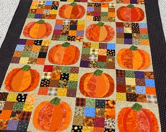 Pumpkin Quilt, fall, autumn, throw size, pumpkins, orange, dots, fray edges, handmade, scrappy squares, quilted, raw edges, green, purple