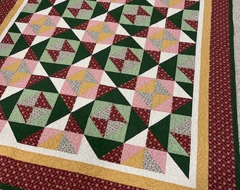 Midnight magic, queen sized quilt, warm colored quilt, quilted queen size, stars and flower quilt.