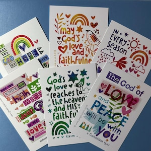 May include: Set of six colourful cards with inspirational messages and illustrations. The cards feature rainbows, stars, birds, and hearts. The messages include "May God's love and faithfulness", "In every season", "The God of love and peace will be with you", "God's love reaches to the heavens and His faithfulness", "May you know how high, wide, deep and long is the love", and "Be the hope".