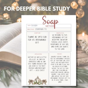 May include: A white SOAP method Bible study worksheet with text, including "Thanks Be Unto God For His Unspeakable Gift." The worksheet is on a table with an open book and candles.