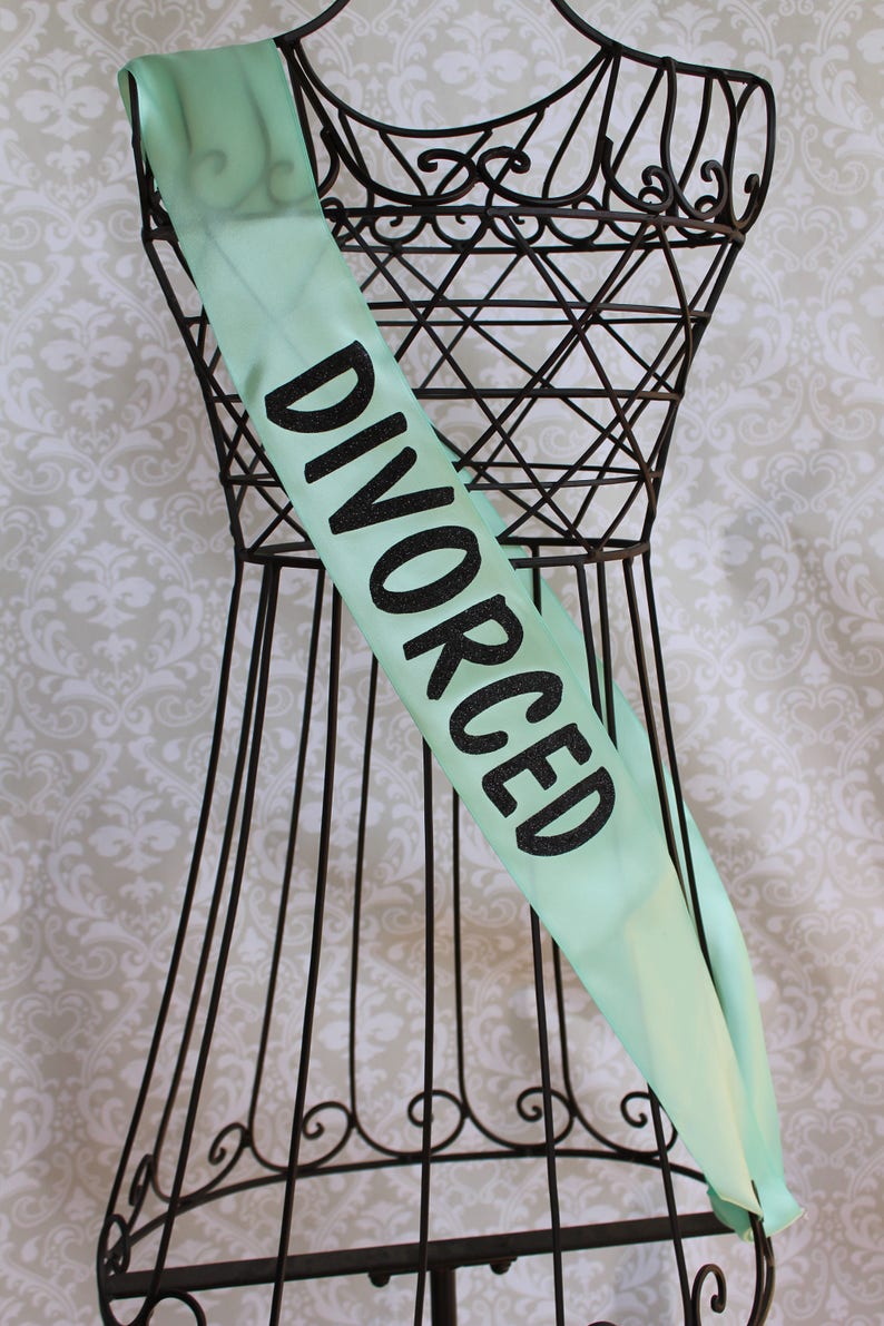 May include: A mint green satin sash with the word "DIVORCED" printed in black glitter.