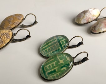 Hand-coated earrings made of recycled fabrics and leather