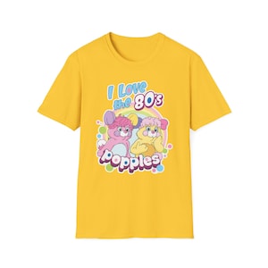 May include: Yellow t-shirt with a graphic of two cartoon characters from the 80s show "Popples". The text "I Love the 80's" is above the characters.