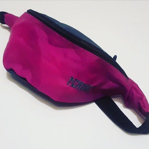 Fanny pack bum bag hip pouch apparel accessories storage organize outdoor sports activewear fashion style retro purple 80s 1980s 90s 1990s