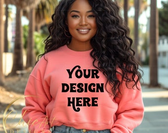African American Woman Wearing Salmon Crewneck Sweatshirt Png Mockup with California Palm Trees in the Background, Design Mocks
