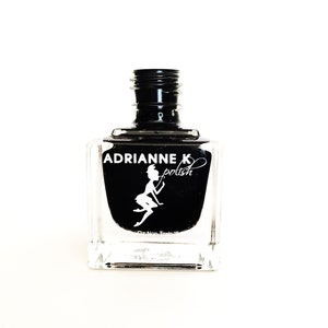 May include: A black nail polish bottle with a clear glass bottle and a black cap. The bottle has a white label with the text "ADRIANNE K polish" and a silhouette of a fairy.