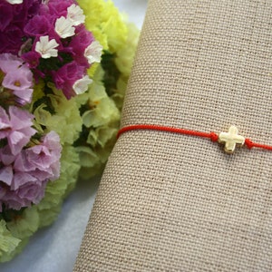 Cross string bracelet best sale