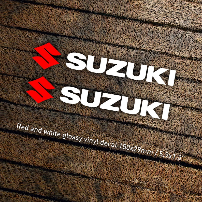 May include: Two red and white glossy vinyl decals with the word "SUZUKI" in white letters. The decals are 5.9 inches by 1.3 inches.