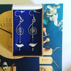 Like a bird on a wire, inspired by Leonard Cohen, Silverwire Treble Clef Earrings with tiny mother of pearl handcarved bird