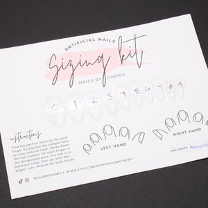 May include: A white card with the text "Artificial Nails Sizing Kit" and "Nails by Chewy". The card includes a set of numbered clear plastic nail tips for sizing, and outlines for the left and right hand with the text "Left Hand" and "Right Hand". The card also includes the text "Nail Shape: Almond (M)".