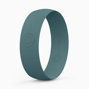 May include: A teal silicone ring with the word "PYRKIA" embossed on the side.