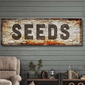 canvas SEEDS sign, designed to look cracked and peely