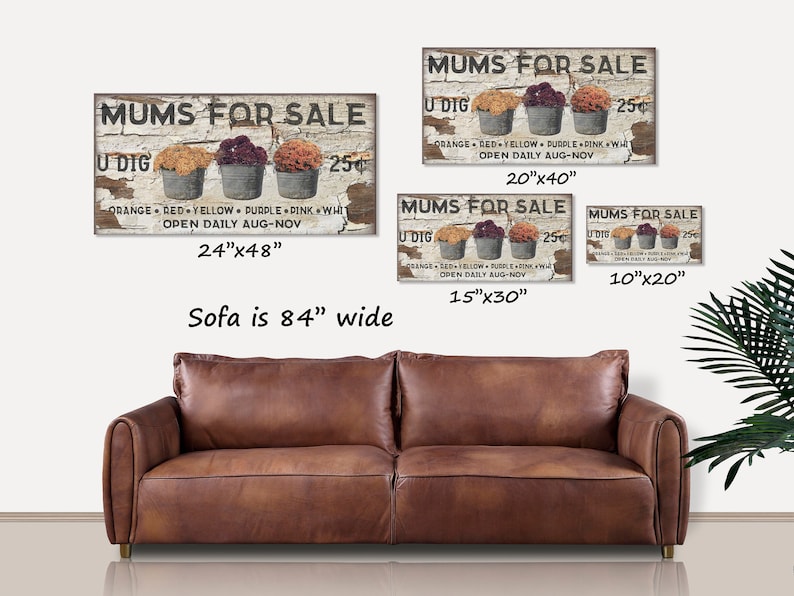 May include: A rustic wooden sign with the text "MUMS FOR SALE" and three metal buckets filled with colorful mums. The sign is available in multiple sizes, including 24"x48", 20"x40", 15"x30", and 10"x20".