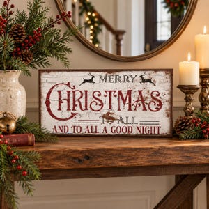 May include: A rectangular wooden sign with a distressed white finish and dark brown edges. The text reads MERRY CHRISTMAS TO ALL AND TO ALL A GOOD NIGHT in red and black lettering, featuring silhouettes of two leaping reindeer.
