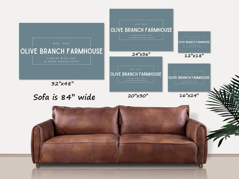 May include: A set of six blue canvas wall art prints with the text "Olive Branch Farmhouse" and different size options. The prints are shown above a brown leather sofa.