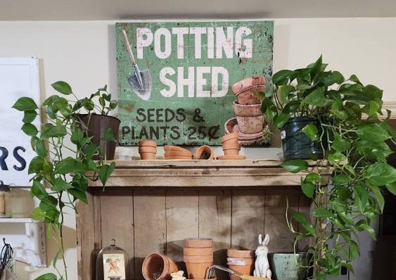 canvas potting shed art designed to look like a rusty metal sign