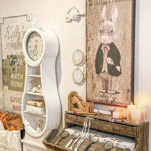 Placa de lona vintage com coelho: Carnaby Square Fine Clothing