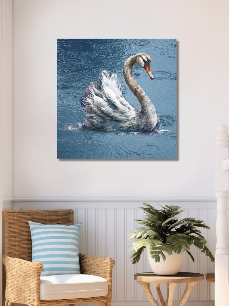 Canvas art of a swan on a lake with beautiful blue water. It is raining and you can see the ripples in the water