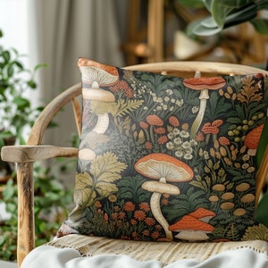 May include: A throw pillow with a dark green background featuring a colorful botanical illustration of mushrooms and flowers. The pillow is made of a soft, comfortable fabric and is perfect for adding a touch of nature to your home decor.
