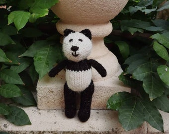 Panda  - a handmade knitted soft toy in naturally coloured black and white 100% wool
