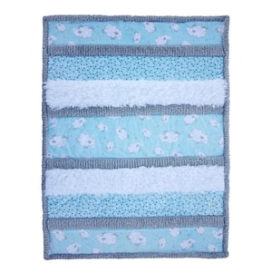 May include: A rectangular baby blanket with a patchwork design. The blanket features alternating stripes of light blue fabric with white cloud patterns, white fluffy fabric, and light blue fabric with small blue dots. The edges are trimmed with gray fabric.