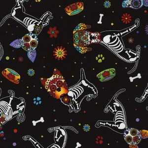 May include: A black fabric featuring a repeating pattern of dogs with colorful sugar skull face designs and white skeletal bodies. The print includes small white bones, multi-colored paw prints, vibrant flowers, and small bowls with heart motifs.