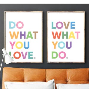 May include: Two framed art prints with the phrases "DO WHAT YOU LOVE" and "LOVE WHAT YOU DO" in colorful block letters. The prints are displayed above a leather headboard and white pillows. The text "by beguima" is at the bottom.