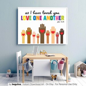 May include: A white printable wall art print with the text "as I have loved you LOVE ONE ANOTHER John 13:34". The print features a colorful illustration of hands with hearts in the palms.