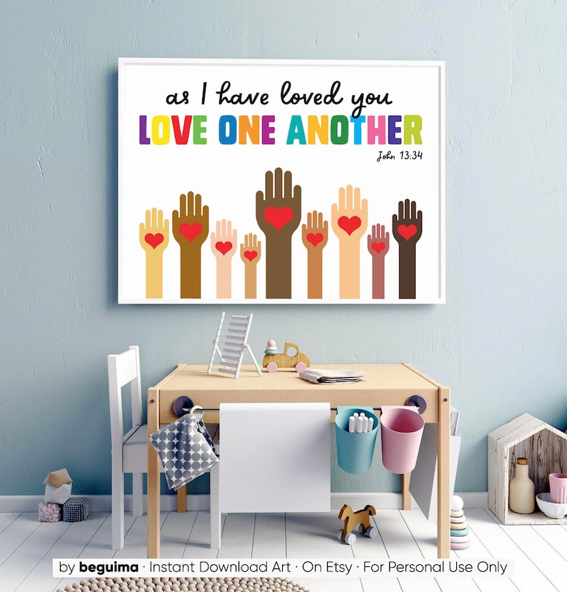 May include: A white printable wall art print with the text "as I have loved you LOVE ONE ANOTHER John 13:34". The print features a colorful illustration of hands with hearts in the palms.