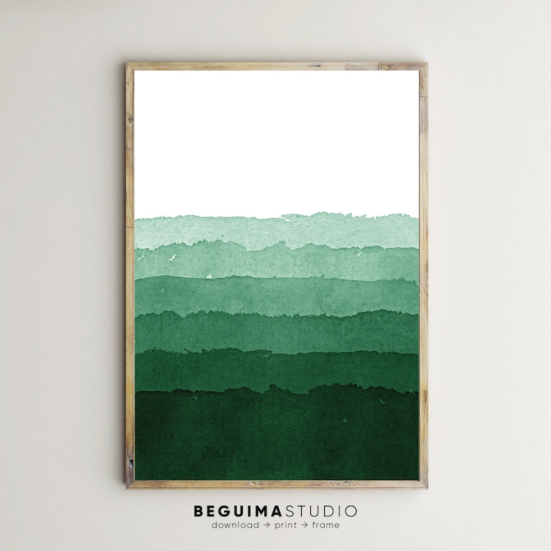 May include: A framed art print featuring a watercolor landscape in shades of green. The artwork depicts horizontal bands of varying green hues, creating a layered effect. The frame is a light brown color. The text "BEGUIMASTUDIO" is at the bottom.
