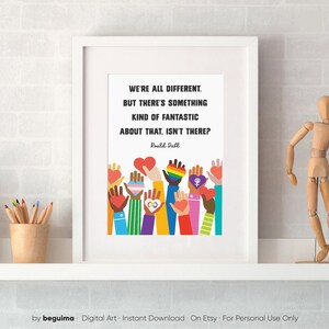 May include: A white framed print with a quote by Roald Dahl: "We're all different. But there's something kind of fantastic about that, isn't there?" The quote is surrounded by colorful illustrations of hands holding hearts and symbols of diversity.