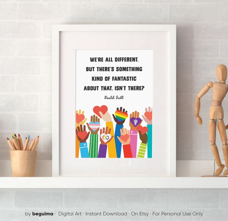 May include: A white framed print with a quote by Roald Dahl: "We're all different. But there's something kind of fantastic about that, isn't there?" The quote is surrounded by colorful illustrations of hands holding hearts and symbols of diversity.