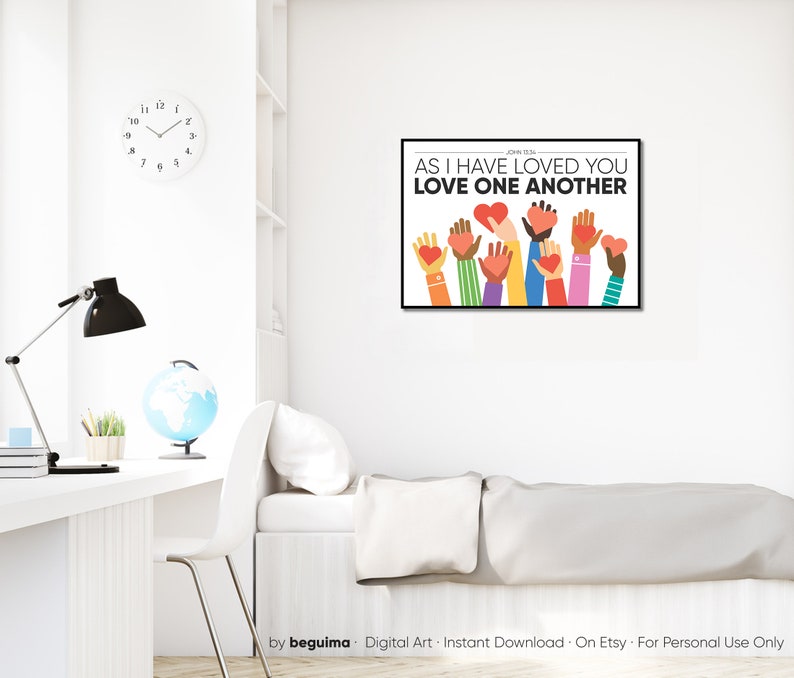 May include: A digital art print with a white background and colorful hands holding red hearts. The text "John 13:34 AS I HAVE LOVED YOU LOVE ONE ANOTHER" is printed in black.