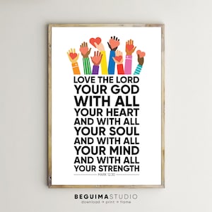 May include: A framed print with the text "LOVE THE LORD YOUR GOD WITH ALL YOUR HEART AND WITH ALL YOUR SOUL AND WITH ALL YOUR MIND AND WITH ALL YOUR STRENGTH" and "MARK 12:30". The top of the print features colorful hands holding hearts. The bottom of the print has the text "BEGUIMASTUDIO".