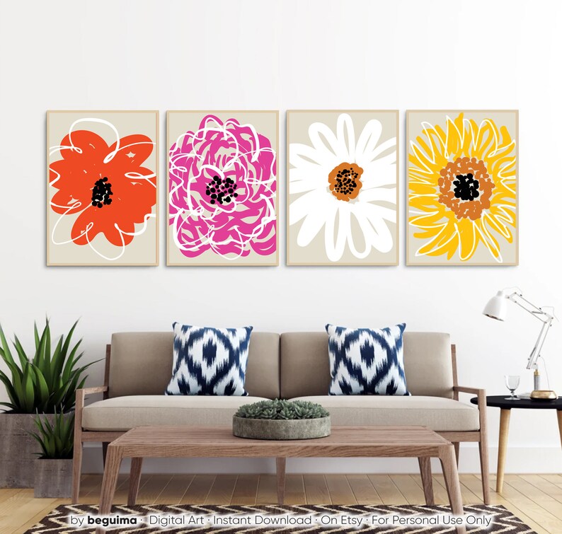 May include: Four framed floral art prints. Each print features a different abstract flower design in vibrant colors: red, pink, white, and yellow. The artwork is set against a neutral background, creating a modern and colorful wall decor.