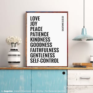 May include: A white framed print with black text listing the fruits of the spirit from Galatians 5:22-23: Love, Joy, Peace, Patience, Kindness, Goodness, Faithfulness, Gentleness, Self-Control.