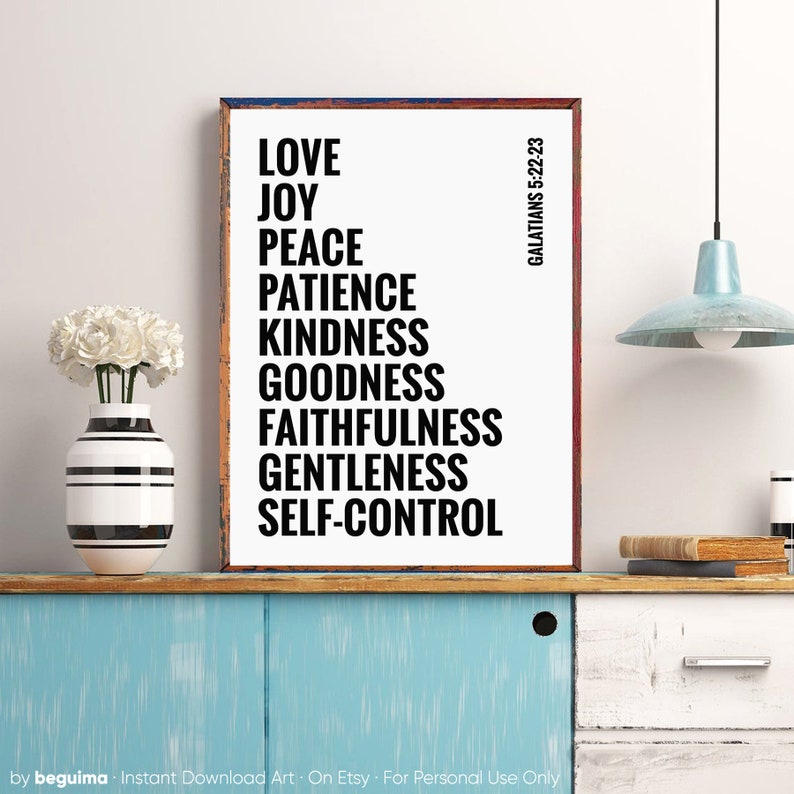 May include: A white framed print with black text listing the fruits of the spirit from Galatians 5:22-23: Love, Joy, Peace, Patience, Kindness, Goodness, Faithfulness, Gentleness, Self-Control.